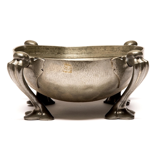 387 - Liberty & Co. A pewter four footed flower bowl designed by Oliver Baker, early 20th c, 26cm diam... 