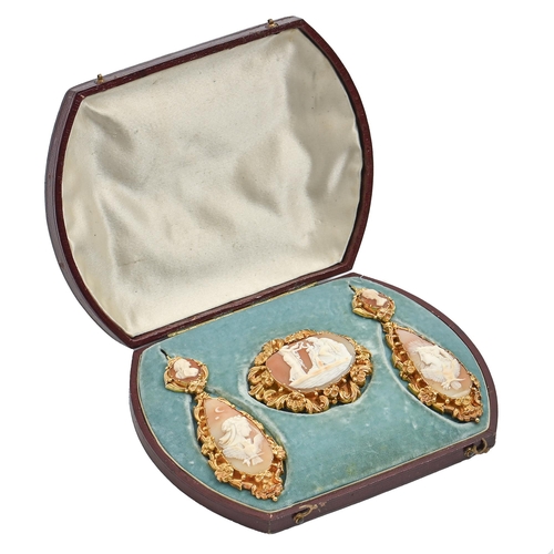 52 - A fine shell cameo demi-parure, c1870, the cameos to the earrings emblematic of night and day, mount... 