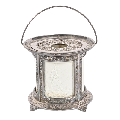 582 - A cast and plated iron lithophane candle light of lantern form, early 20th c, with two mountain scen... 