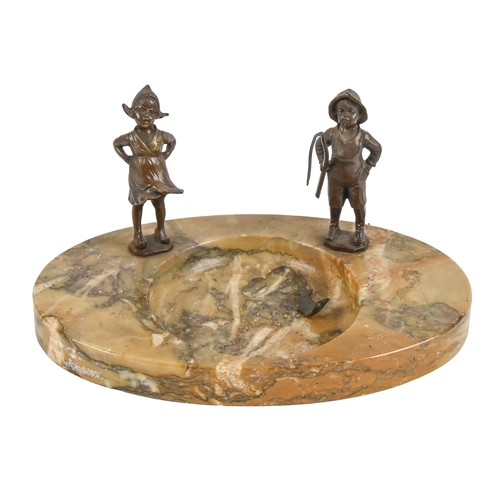 592 - An Art Deco bronze mounted siena marble ashtray, c1930, designed as a pond set with the figures of a... 