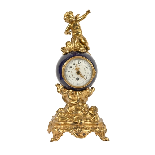 599 - A French giltmetal and porcelain figural timepiece, early 20th c, mounted with a cherub, painted ena... 