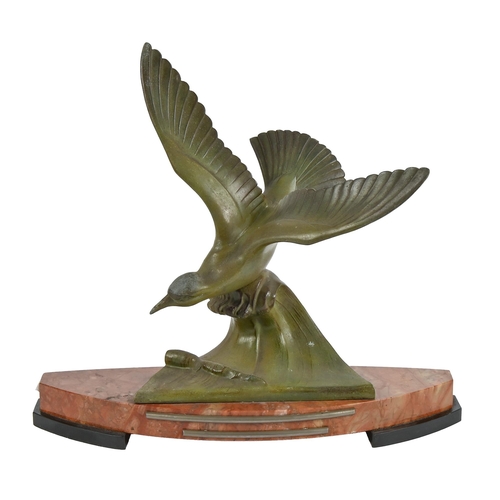 617 - An Art Deco bronzed spelter sculpture of a seabird in flight, on marble base, 41cm h; 46cm w... 