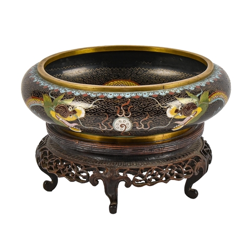 619 - A Chinese cloisonne enamel bowl, 20th c, with ferocious dragons on a black ground, 20cm diam, four c... 