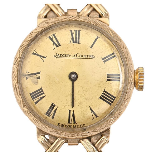 63 - A Jaeger LeCoultre gold lady's wristwatch, 20mm diam, marked on case back 1148161, on associated gol... 