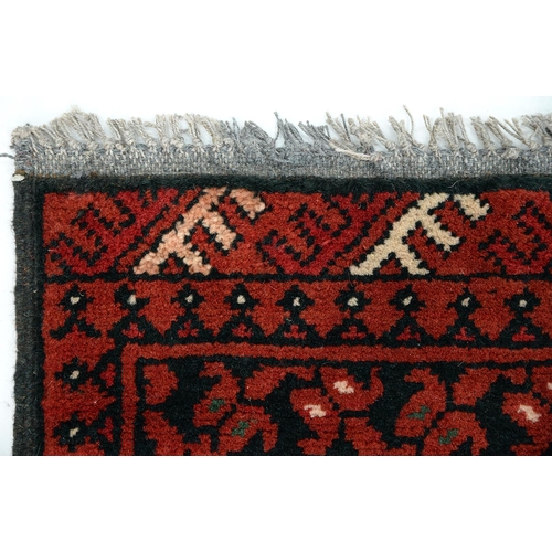 915 - A Pakistan rug, 117 x 74cm, a Persian rug, 79 x 53cm and an Afghan rug, 69 x 50cm (3)... 