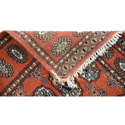 915 - A Pakistan rug, 117 x 74cm, a Persian rug, 79 x 53cm and an Afghan rug, 69 x 50cm (3)... 