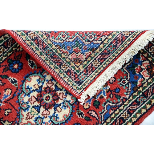 915 - A Pakistan rug, 117 x 74cm, a Persian rug, 79 x 53cm and an Afghan rug, 69 x 50cm (3)... 