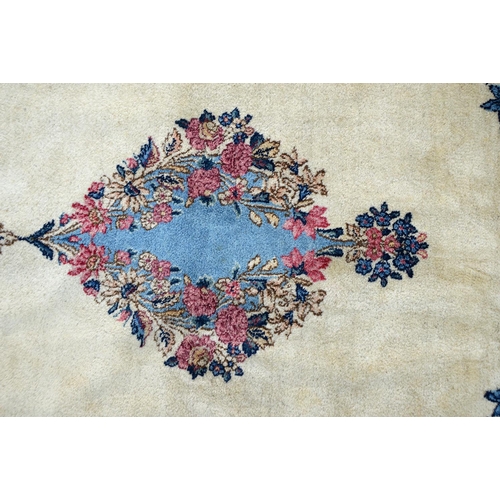 916 - An Indian wool carpet of unusually large size, 20th c, 405 x 625cm