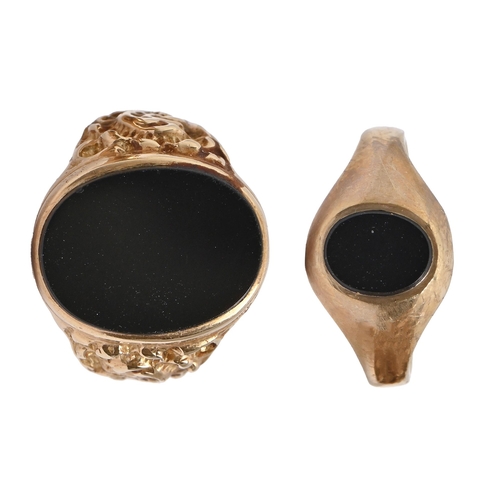 97 - Two black onyx signet rings, in 9ct gold, 16.2g, size V