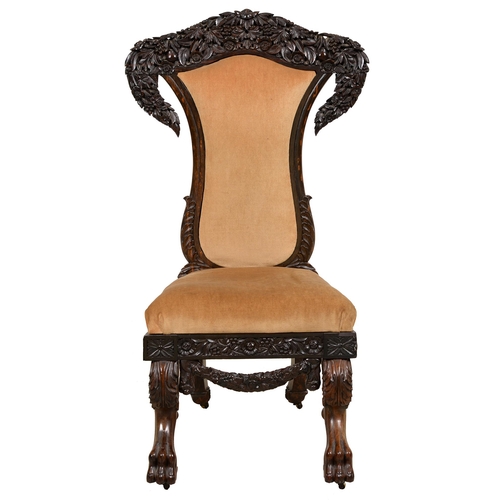 1154 - An ebony chair, prie dieu, British Ceylon, Galle District, c1850-1870, profusely carved with flowers... 