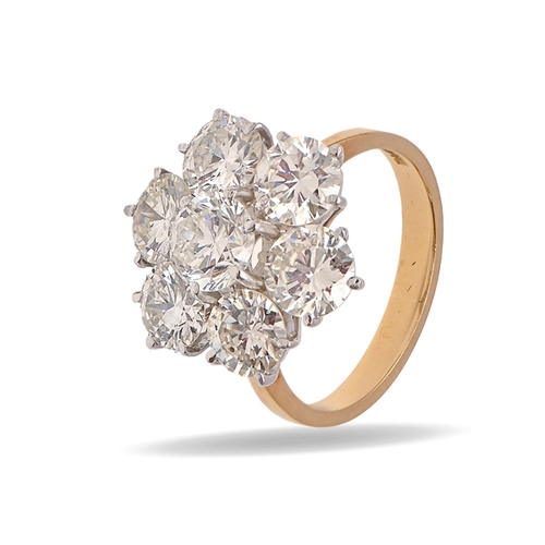 101 - A diamond ring, of seven round brilliant cut diamonds, in 18ct gold, import marked London 1970, 5.7g... 