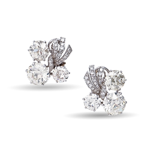 102 - A pair of French diamond earrings,  mid 20th c, of stylised floral design with three principal diamo... 