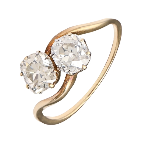 104A - A diamond ring,  with two cushion shaped old cut diamonds, in gold, 3.7g, size S... 