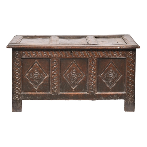 1085 - An 18th c carved and panelled oak blanket box, the interior with a till, 65cm h; 121 x 53cm... 