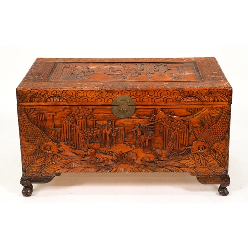 1087 - A Chinese camphor wood chest,  ornately carved with carp and figures, 59cm h; 101 x 53cm... 