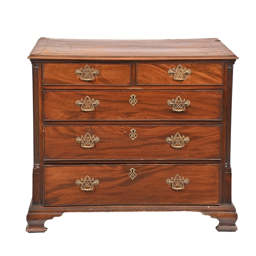 1099 - A George III mahogany chest of drawers,  of two short and three long drawers flanked by carved pilas... 