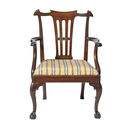 1101 - A Victorian mahogany elbow chair,  with pierced splat and carved front legs  with claw and ball feet... 