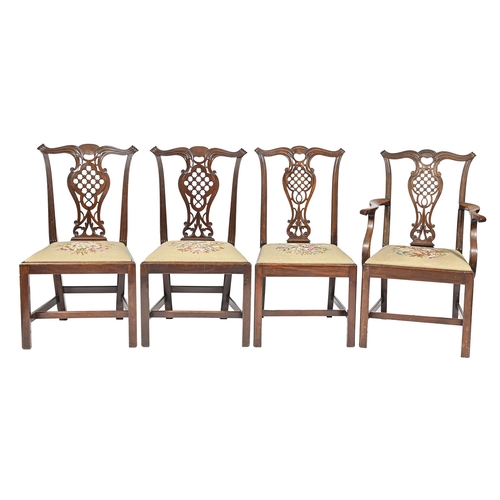 1115 -  A set of four mahogany dining chairs,  including an elbow chair,  with carved and pierced splat, se... 