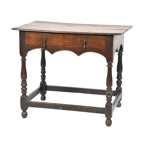 1119 - A George III oak lowboy,  on turned legs with stretcher base, 69cm h; 82 x 52cm