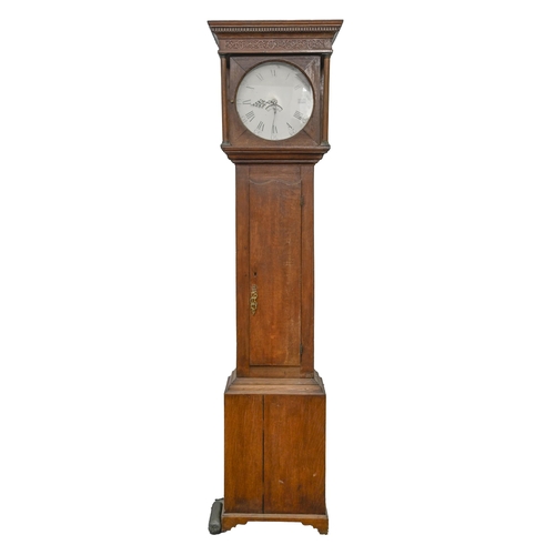 1131 - A Victorian oak thirty hour longcase clock,  the painted dial flanked by turned pillars with dentil ... 