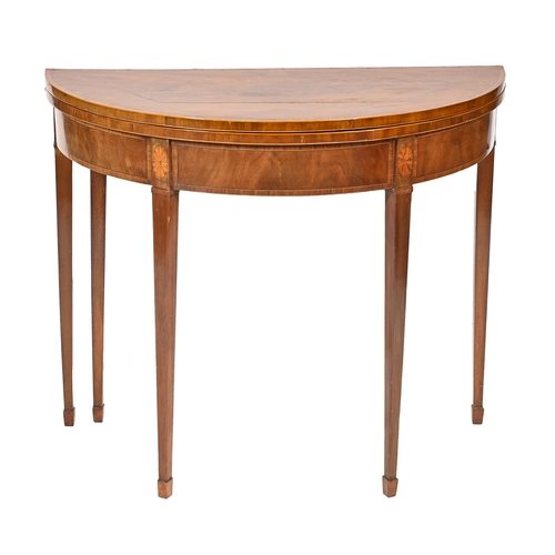 1166 - An early 20th c inlaid mahogany card table, on square tapering legs, 74cm h; 91cm w