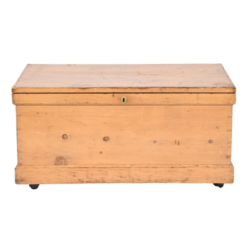 1169 - A Victorian waxed pine trunk, with iron handles, on later castors, 54cm h; 107 x 53cm... 