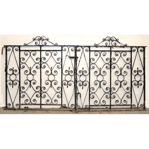 1178 - A pair of wrought iron gates, 116cm h; 115cm l (x2)