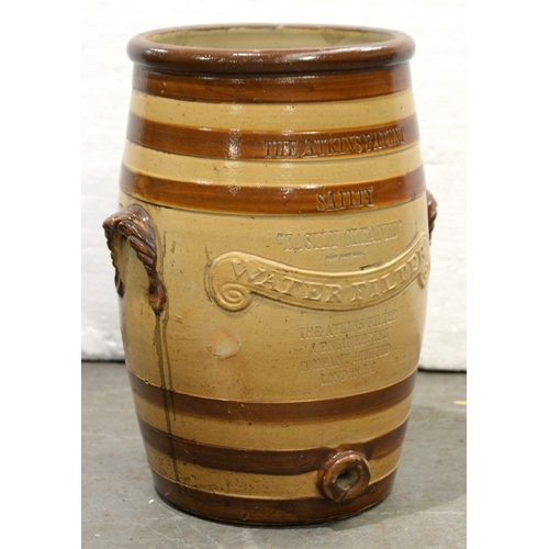 1195 - A Victorian Atkins Patent saltglazed brown stoneware water filter, of barrel shape, with shell handl... 