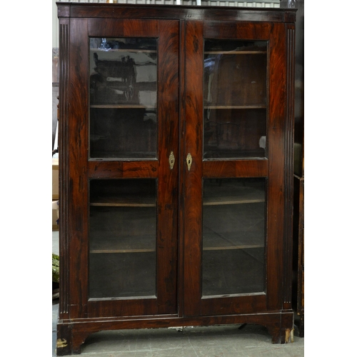 1209 - A grained rosewood bookcase, 19th c, fitted with adjustable shelves enclosed by a pair of glazed doo... 