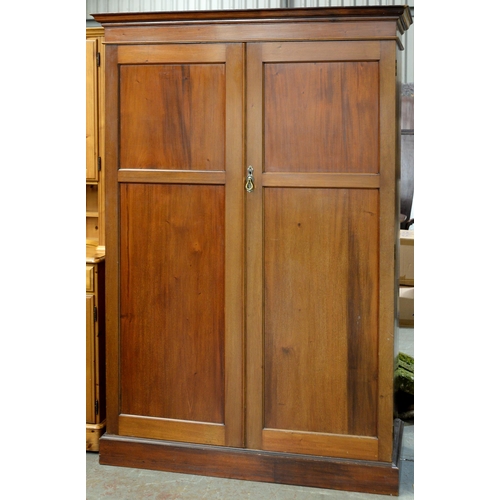 1210 - A mahogany wardrobe, c1920, with fitted interior, enclosed by a pair of panelled doors, 192cm h; 120... 