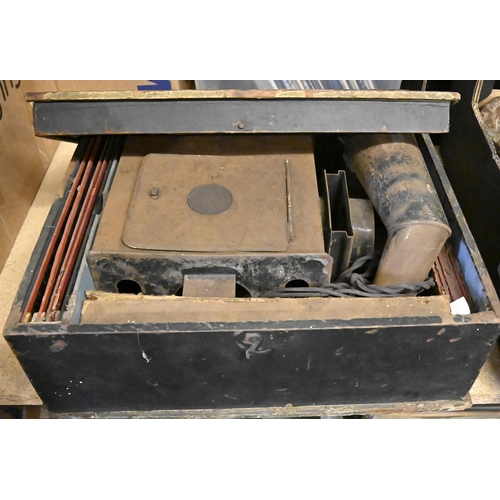 1229 - An Ernst Plank tinplate magic lantern, with lens, chimney and glass slides, in the original papered ... 