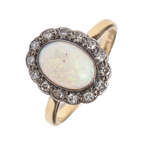 192 - An opal and diamond ring, gold hoop marked 18ct WHITE GOLD, 3.1g, size K