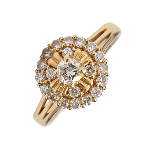 200 - A diamond ring, of tiered cluster design, in 18ct gold, 3.6g, size O