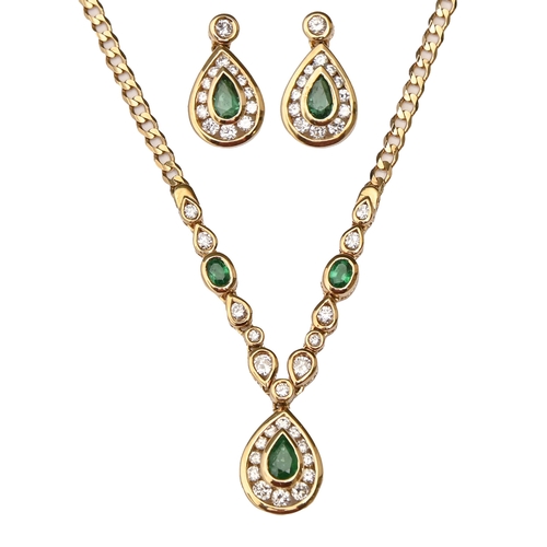 207 - An emerald and diamond necklet, with pear shaped drop, in gold, 44cm l, marked 750 and a pair of ear... 