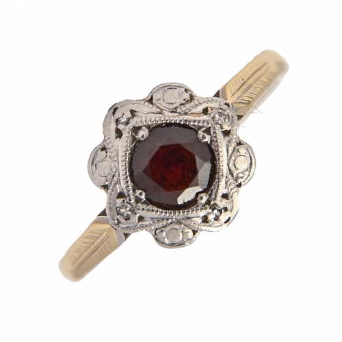 222 - A garnet ring, illusion set in gold marked 18c, 2.5g, size I