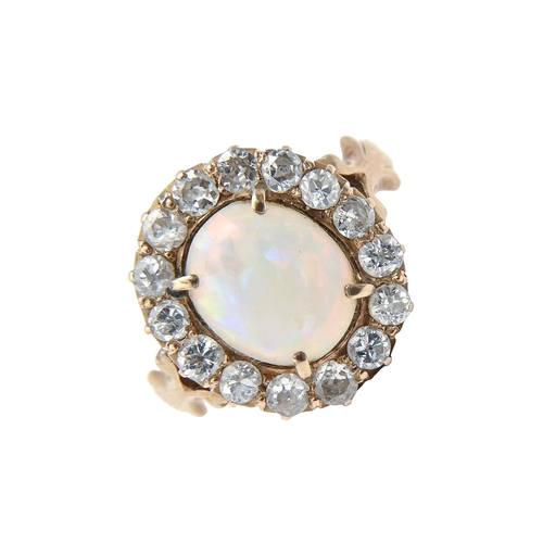 222G - An opal and diamond ring, in gold, head 9 x 11mm, marked 18ct, 4.1g