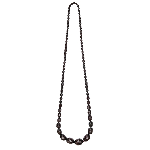 223 - A necklace of faceted faturan beads, 62g