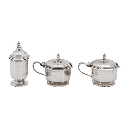 302 - A George V octagonal silver condiment set, blue glass liners, pepperette 80mm h, by Mappin & Web... 