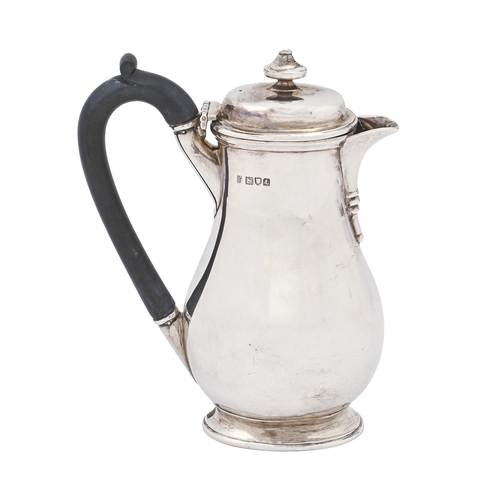 324 - A George V silver lidded jug, of oval section, 19cm h, by C S Harris & Sons Ltd, London 1914, 12... 