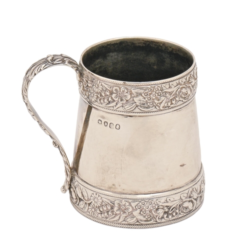 326 - A George III silver christening mug, applied with bands of flowers and foliage, the handle embossed ... 