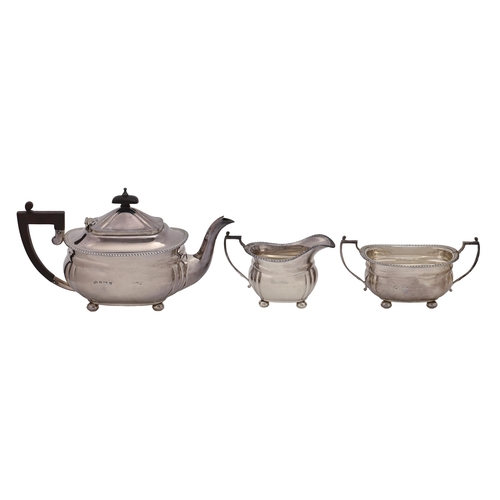 333 - An Elizabeth II silver tea service, with gadrooned rim, on bun feet, teapot 14.5cm h, by Elkington &... 