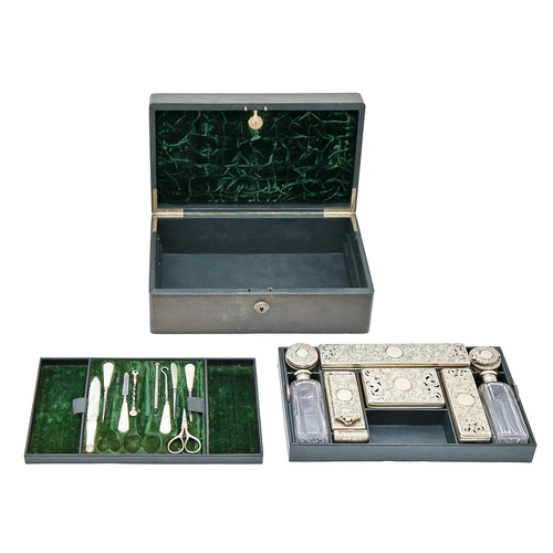 349 - A William IV silver gilt - fitted green morocco leather dressing case, the accessories including pai... 