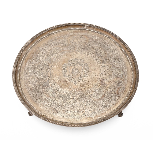 367 - A George III silver salver, with beaded rim, on four fluted feet, later chased, 33cm diam, by Daniel... 