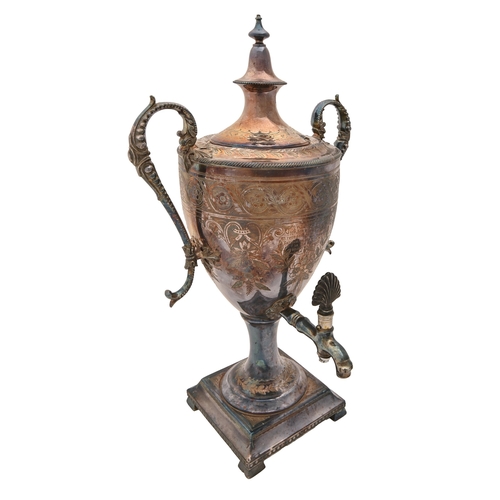 378 - An Edwardian shield shaped EPNS tea urn and cover, engraved with presentation inscription dated 1911... 