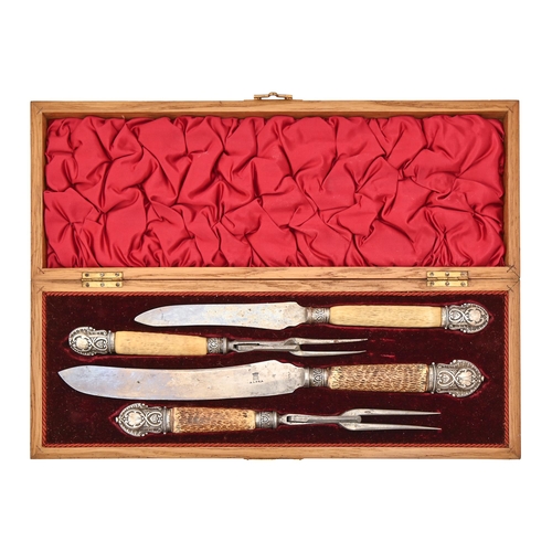 380 - A Victorian silver mounted antler hafted carving set, Sheffield 1895, in plush lined and fitted oak ... 