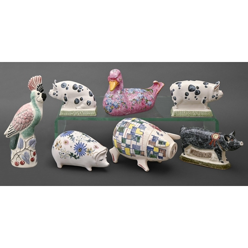 409 - Seven Rye Pottery animals, comprising a pinhole pierced pig, patchwork painted pig shaped jar and co... 