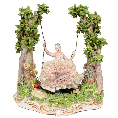 453 - An Italian porcelain figure of a girl on a swing, 20th c, 28cm h, painted Made in Italy... 