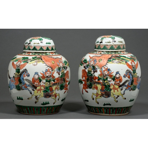 455 - A pair of Chinese famille verte jars and covers, 20th c, enamelled with warriors, 28cm h... 