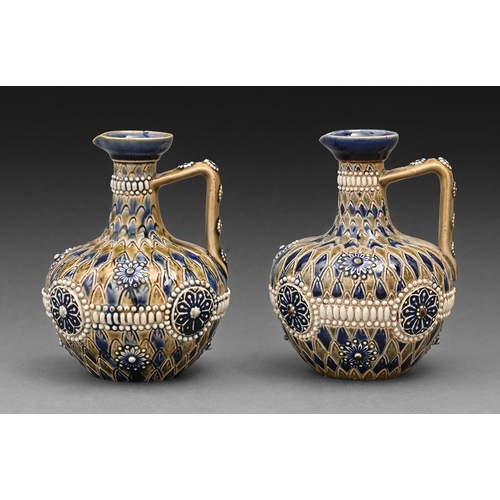 503 - A pair of Doulton ware ewers, c1900, sprigged with rosettes, 11.5cm h, impressed mark... 