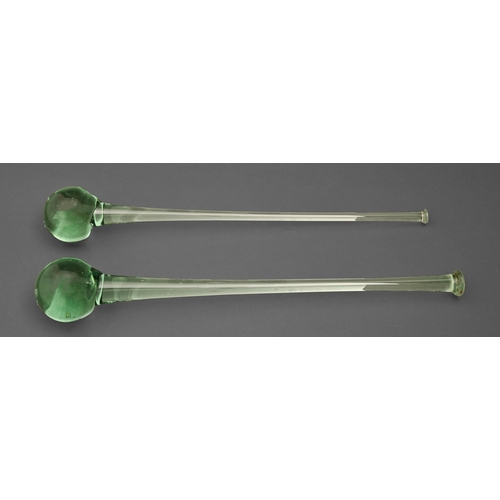 507 - Two Victorian green glass ornamental clubs, 53 and 56cm l